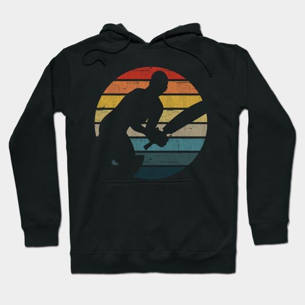 Cricket Player Silhouette On A Distressed Retro Sunset design Hoodie by theodoros20